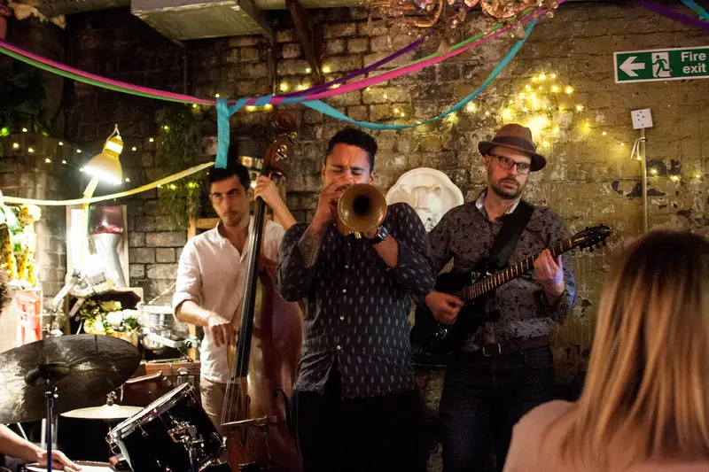 A live jazz trio performing in The Bunker at Love Shack London